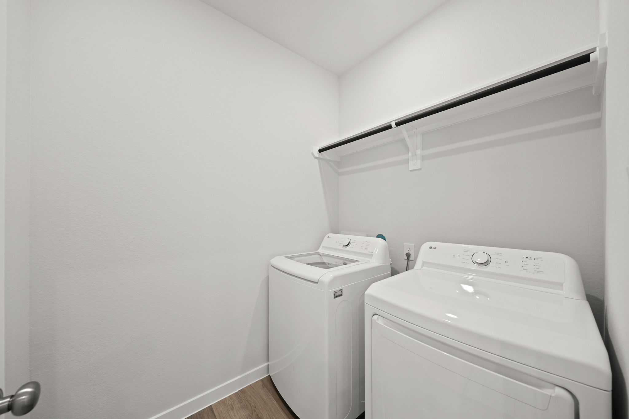 A washing machine in a room.