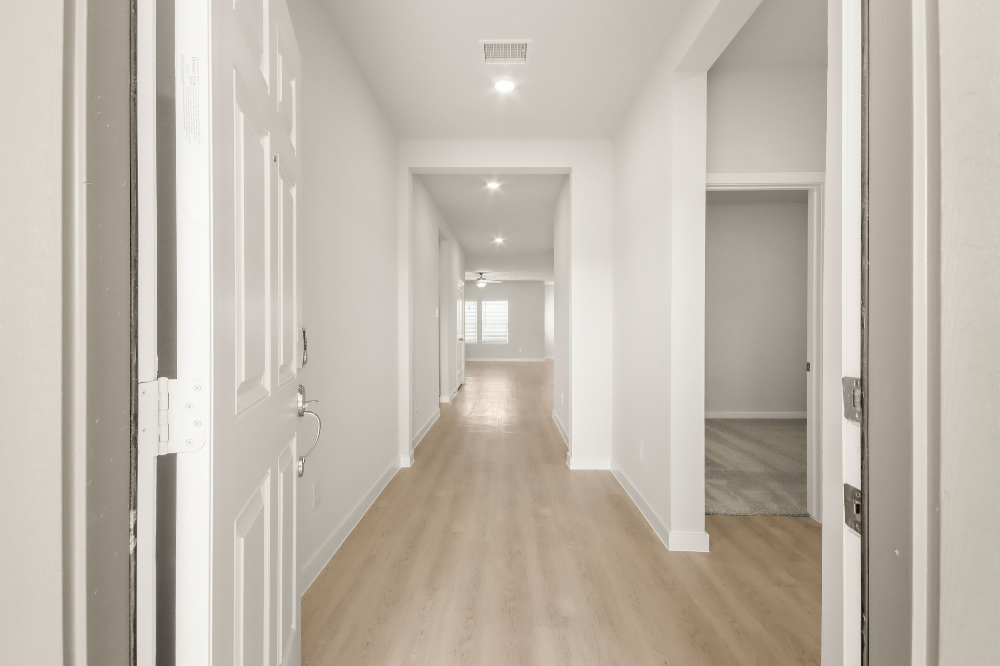 A hallway with white walls.