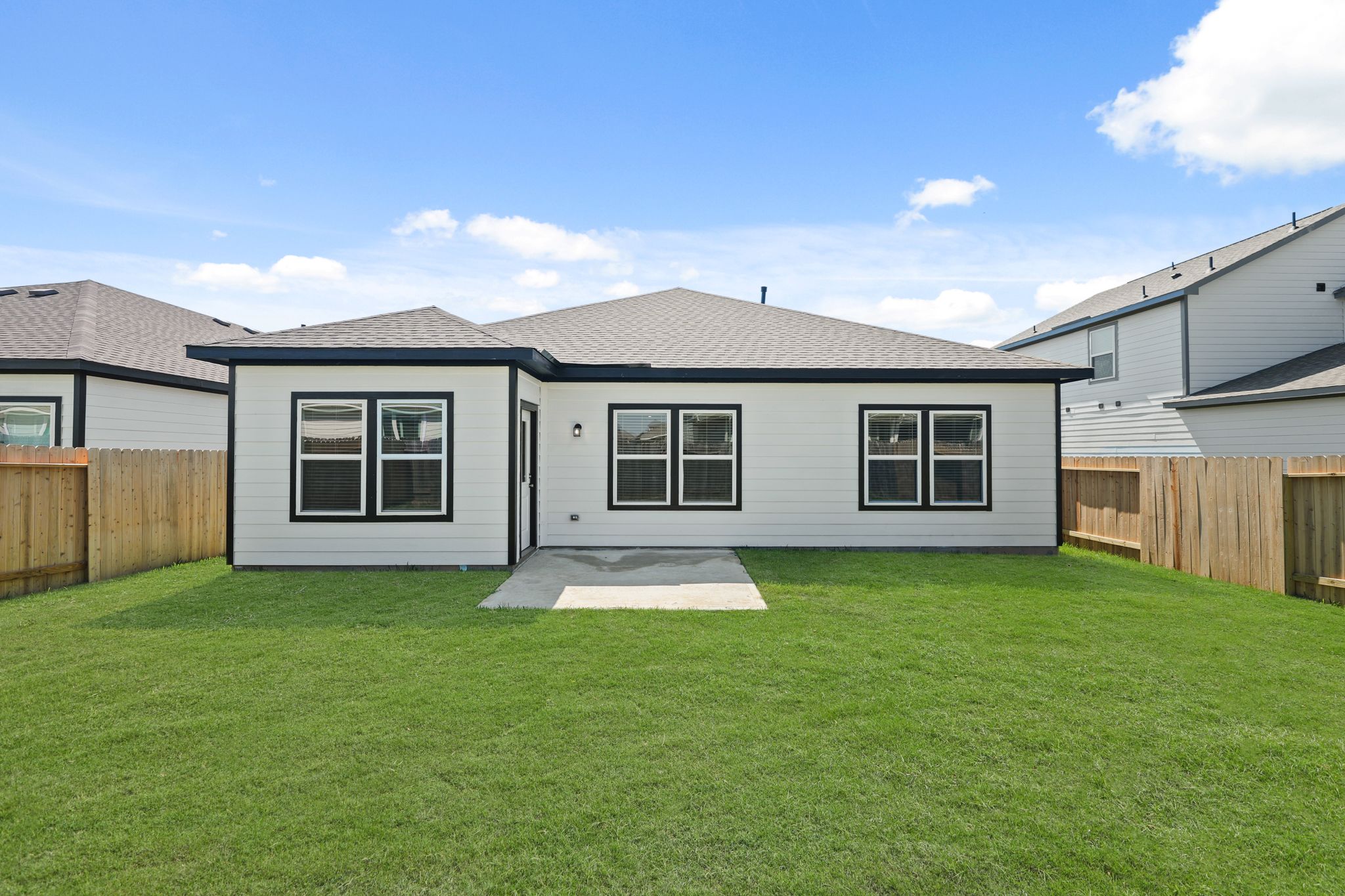 A house with a green lawn.
