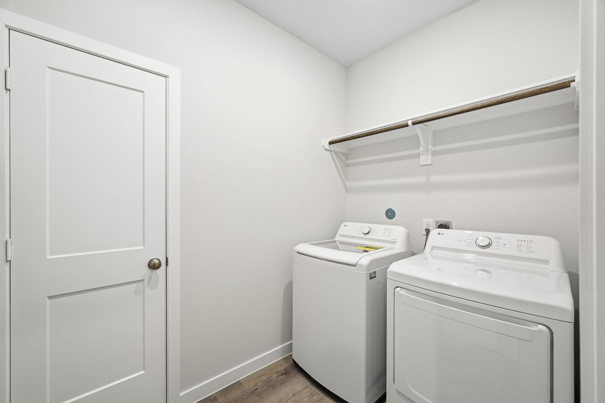 A laundry room with a washer and dryer.