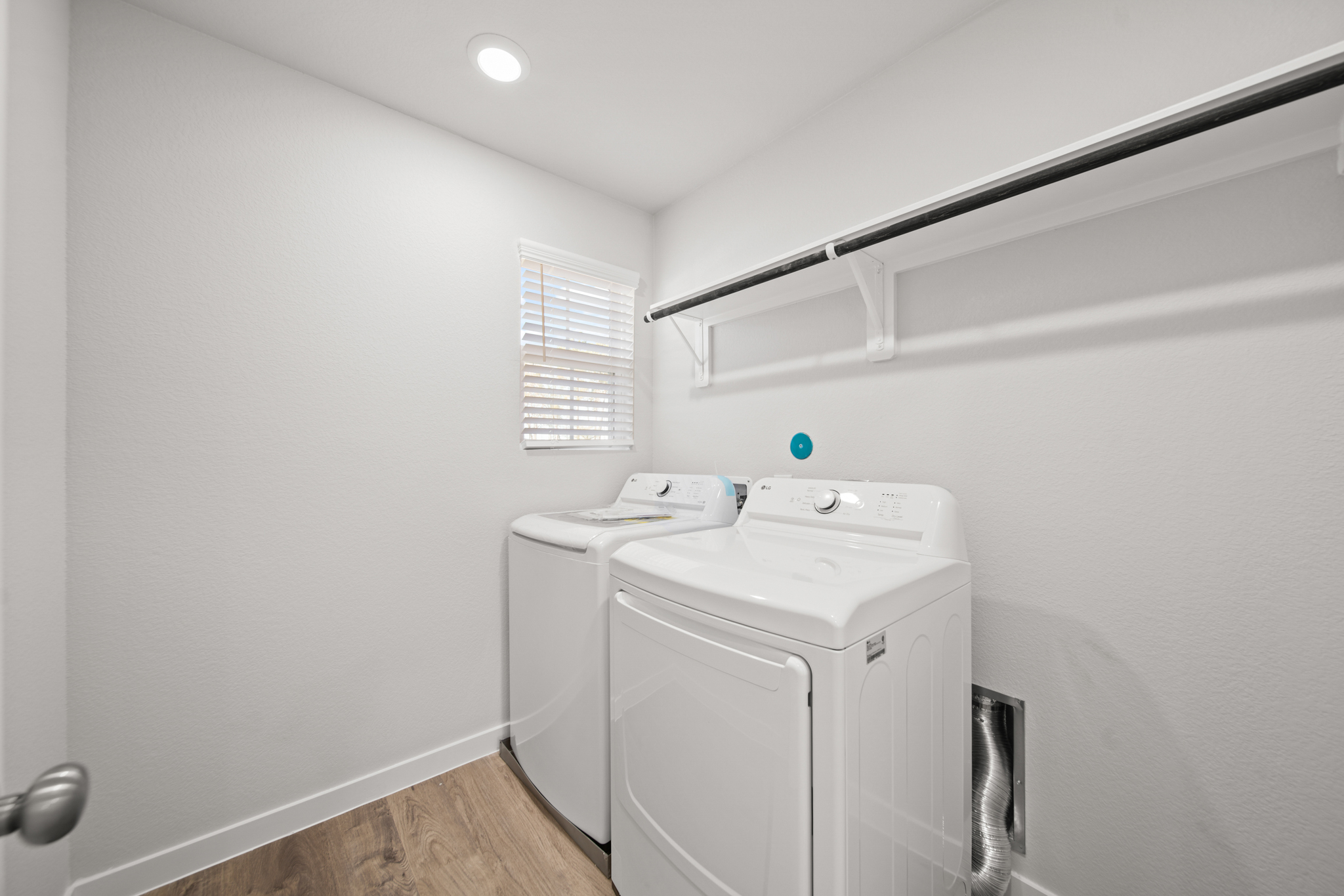 A white room with a white wall and a white cabinet.