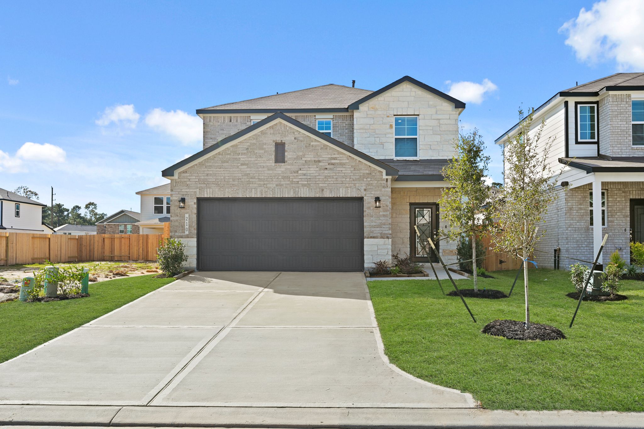 A driveway leading to a house.