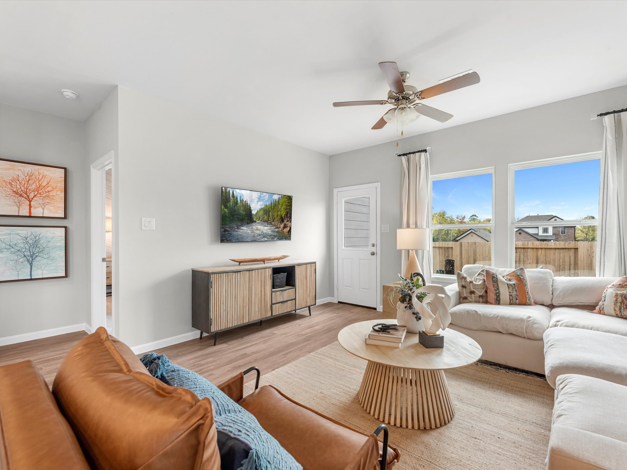 A living room with a large window.