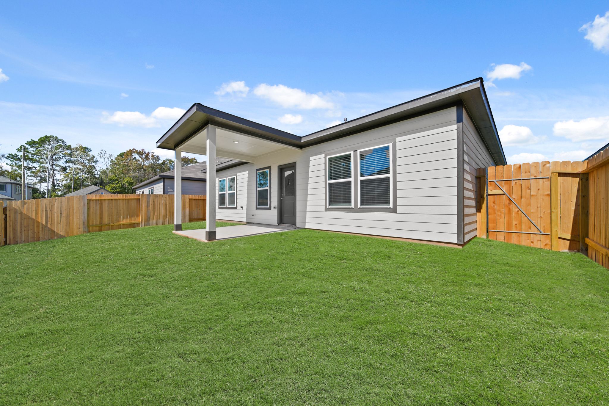 A house with a grass yard.