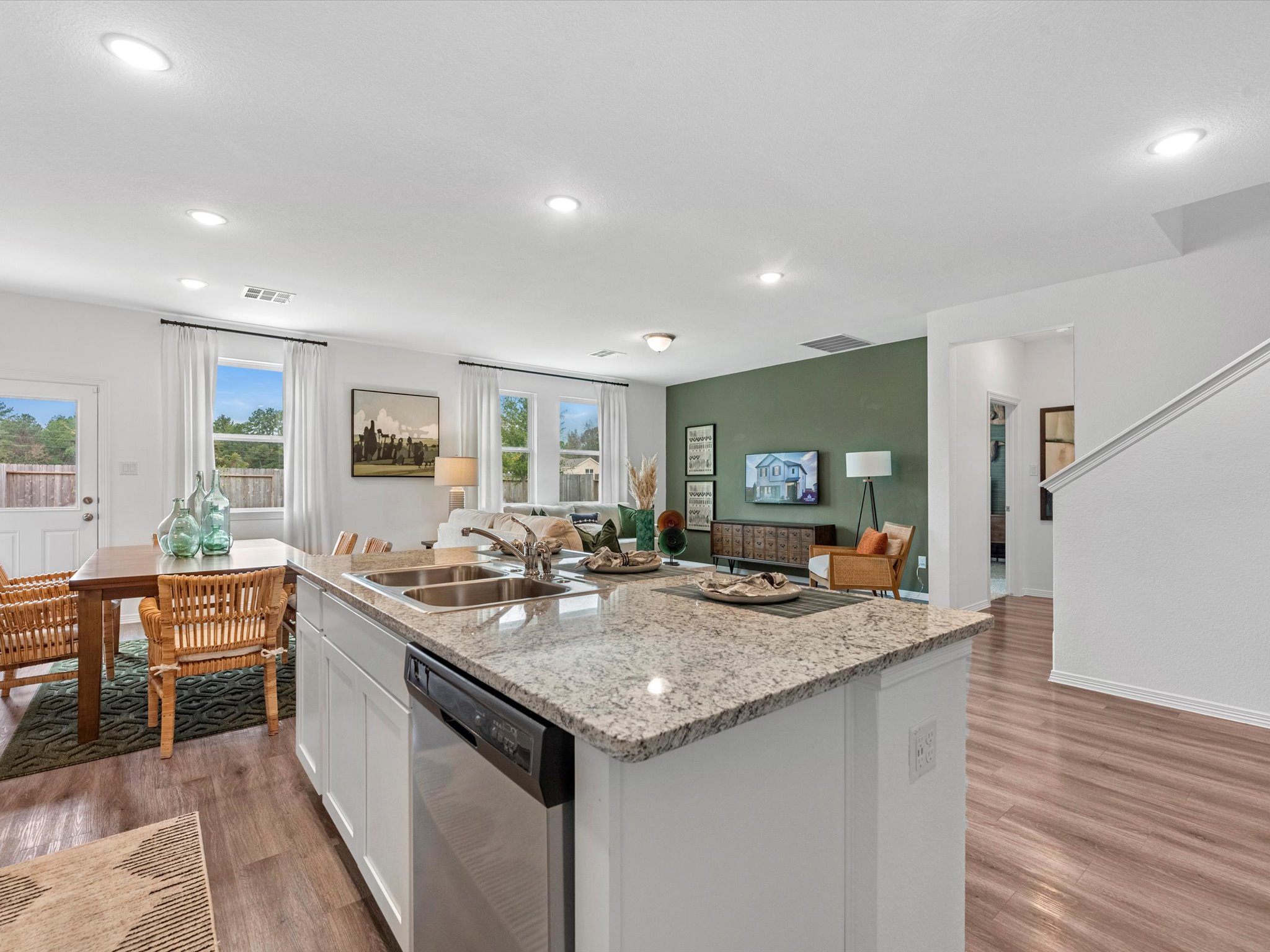 A kitchen with a marble island.