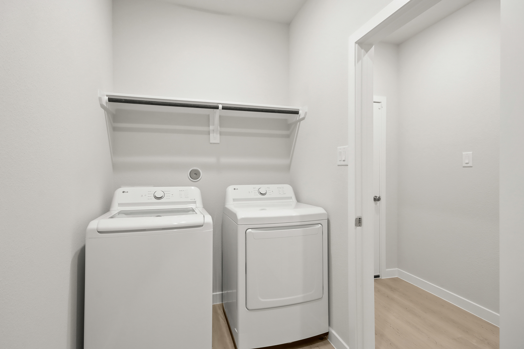 A washing machine in a room.