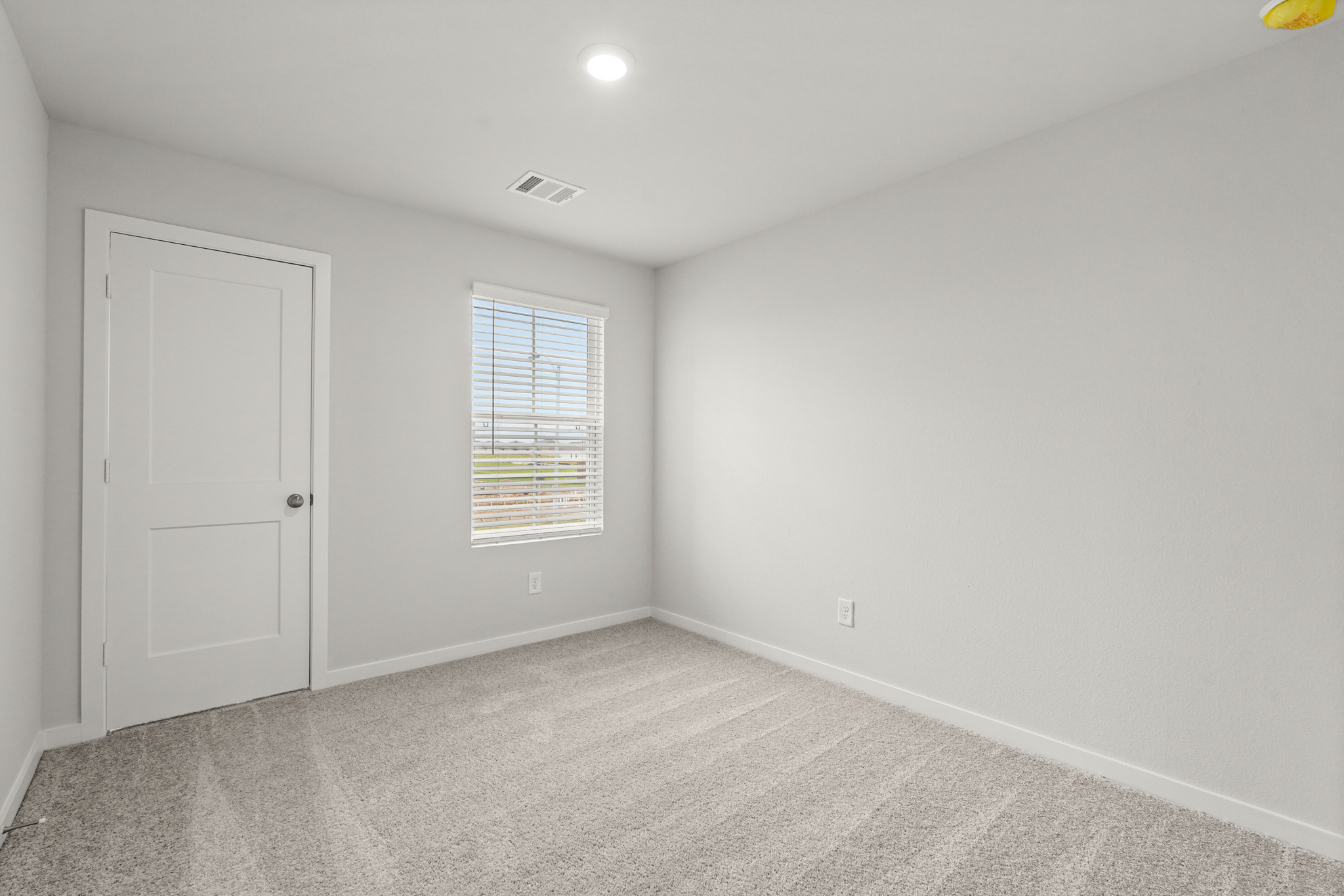 A room with a door and a window.