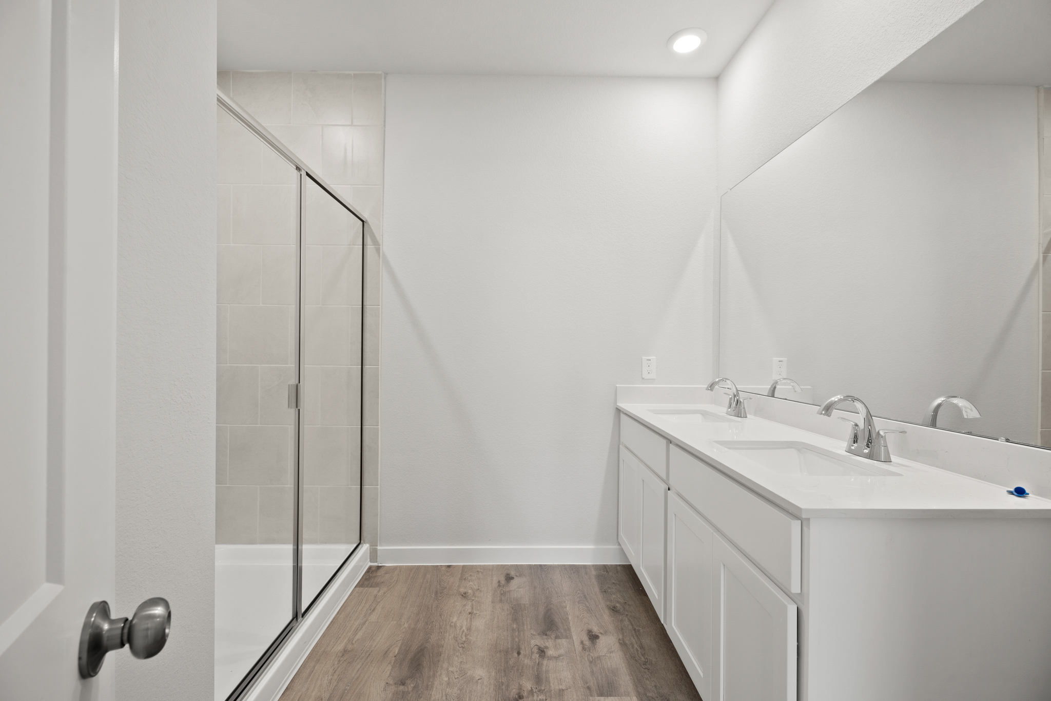 A bathroom with a glass shower.