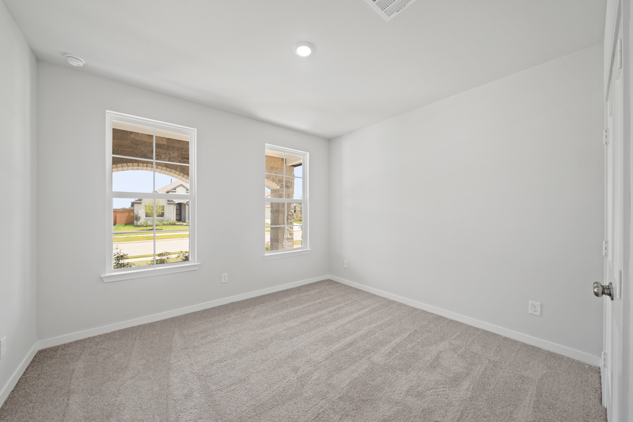 A room with a window and a door.