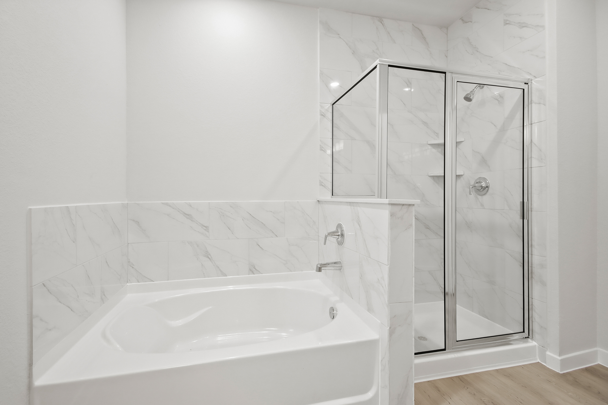 A bathroom with a glass shower.