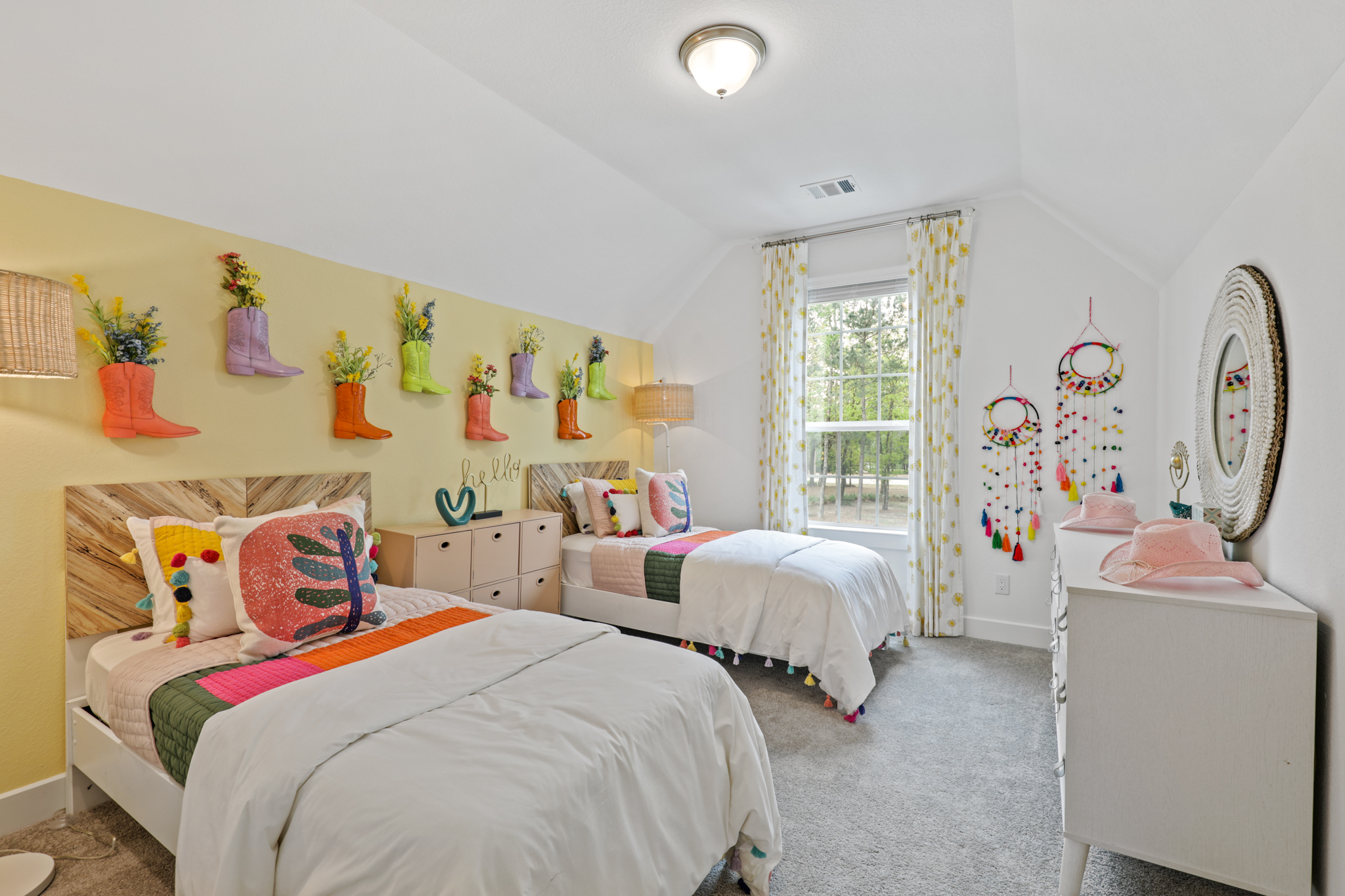 A bedroom with two beds.