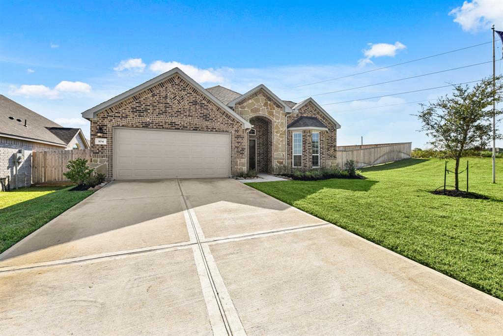 A driveway leading to a house.