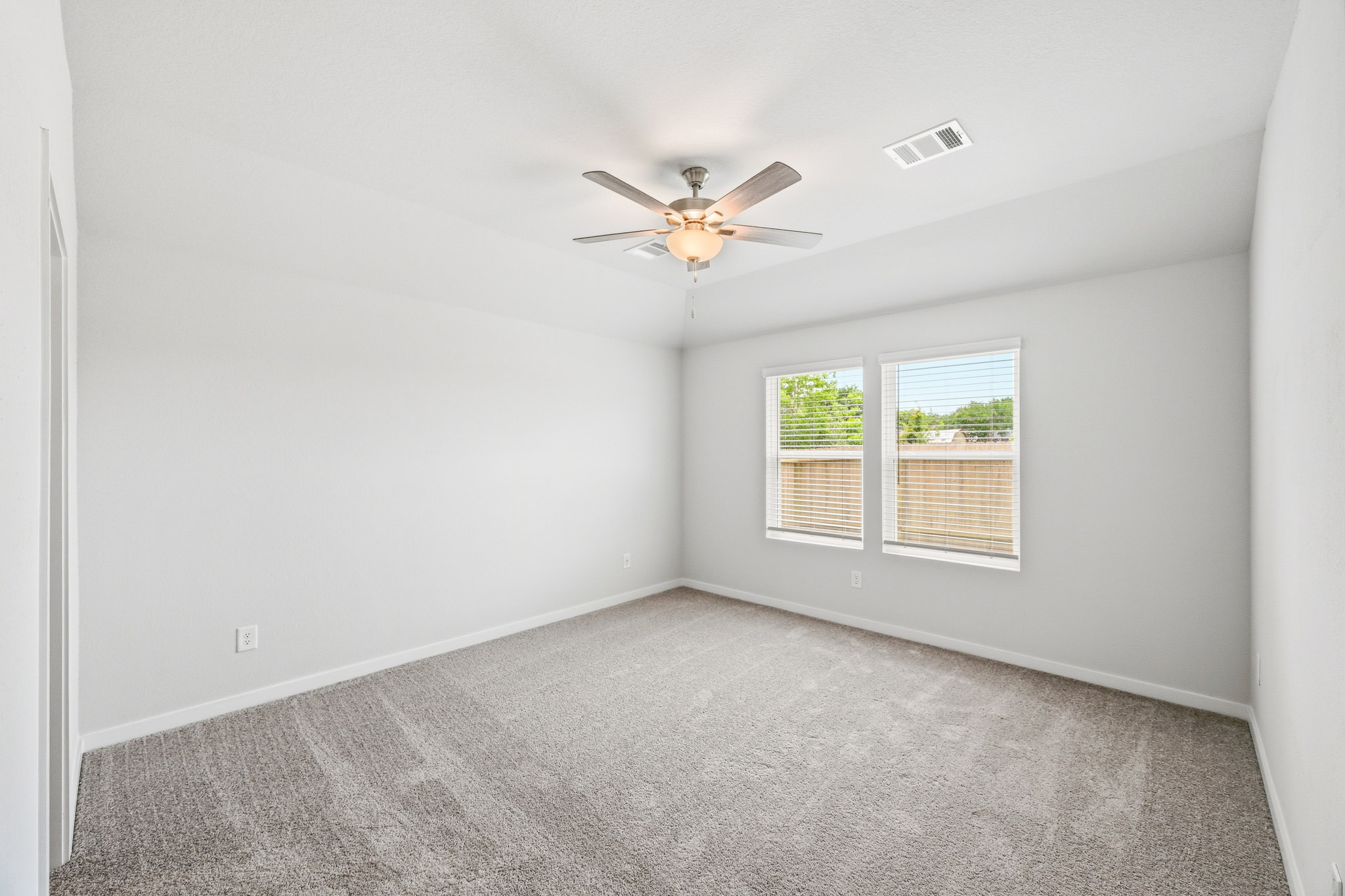 A ceiling fan in a room.