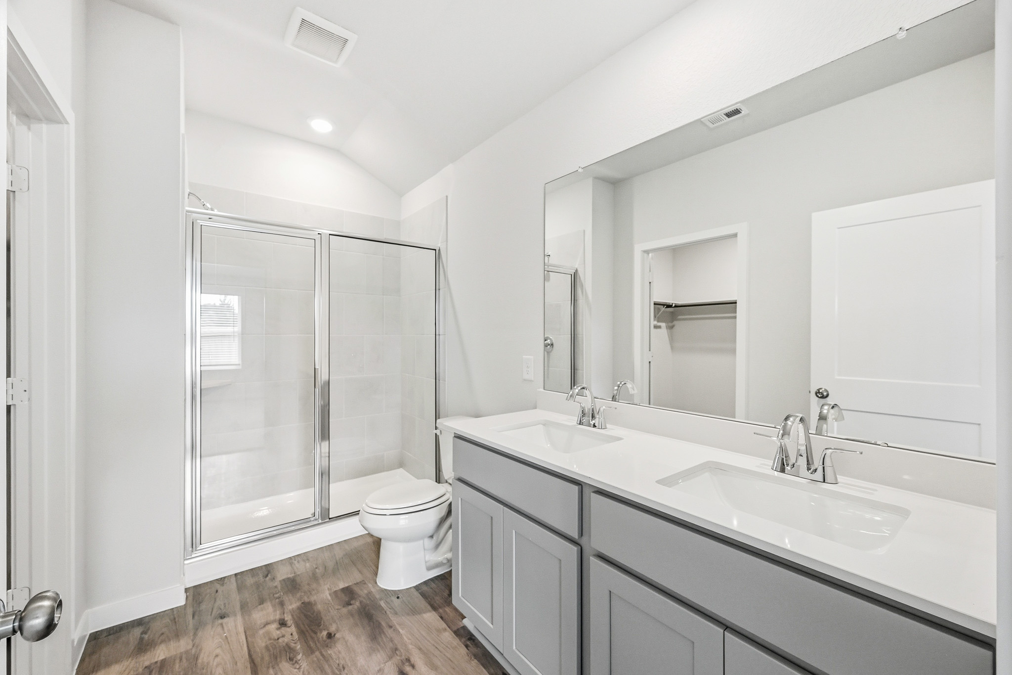A bathroom with a glass shower.