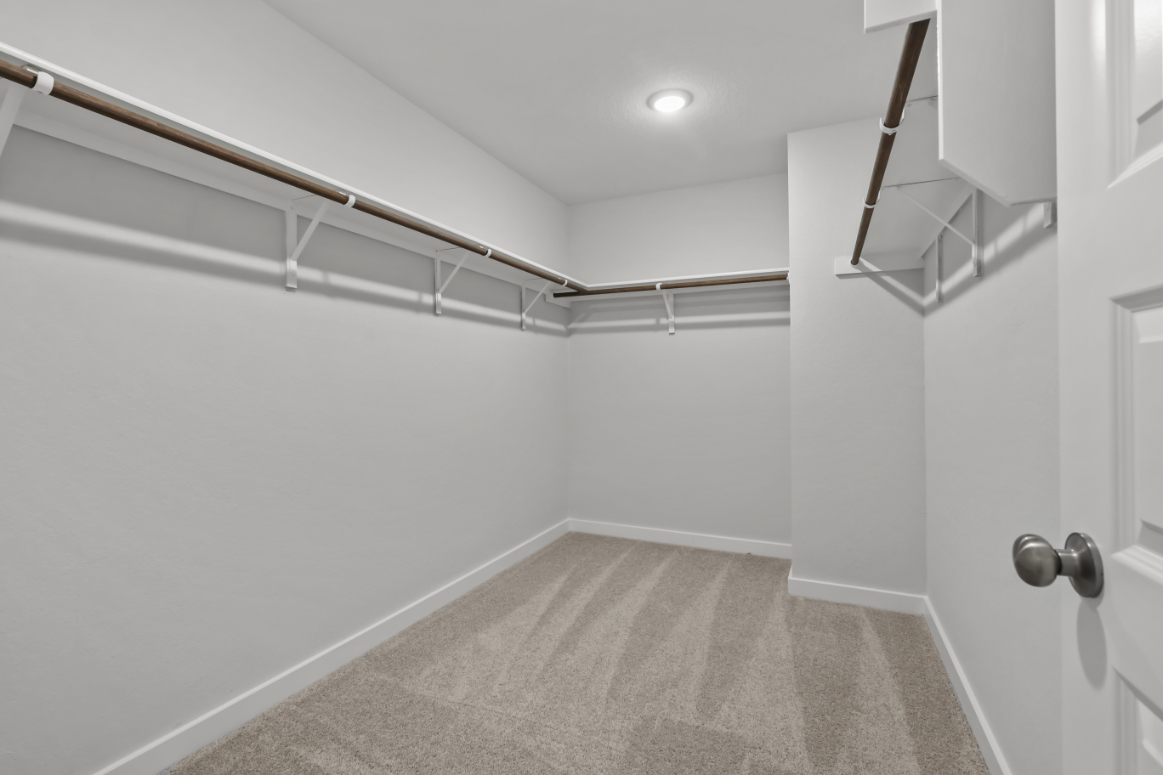 A hallway with white walls.