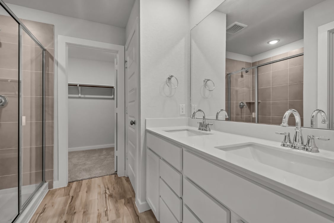 A bathroom with a glass shower.