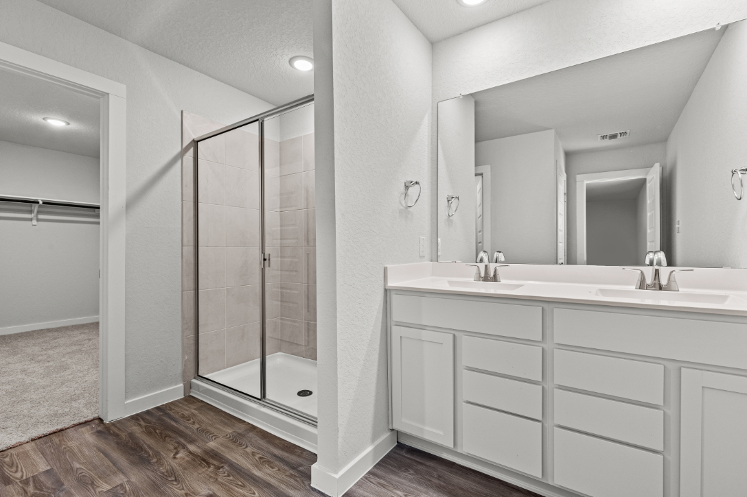 A bathroom with a glass shower.