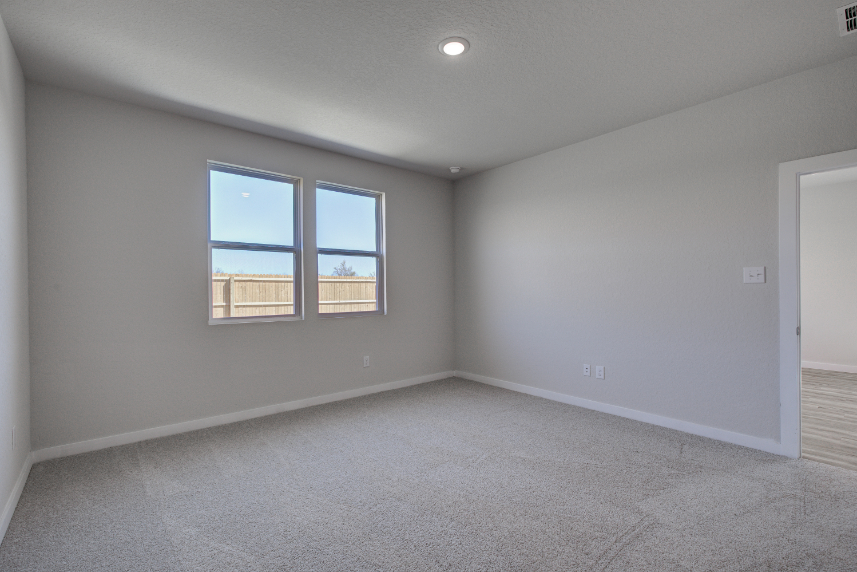 A room with a window and a door.
