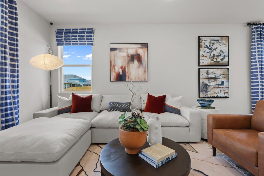 A living room with a large window.
