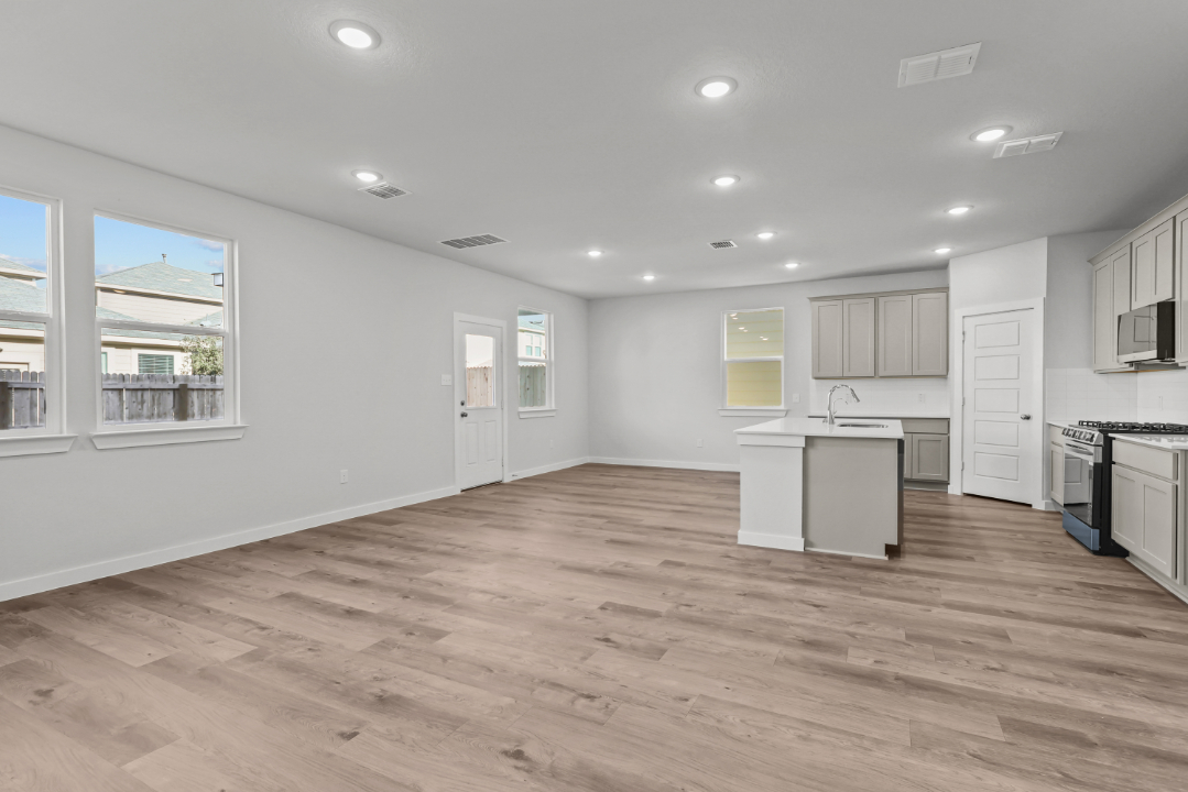 A large kitchen with white cabinets.