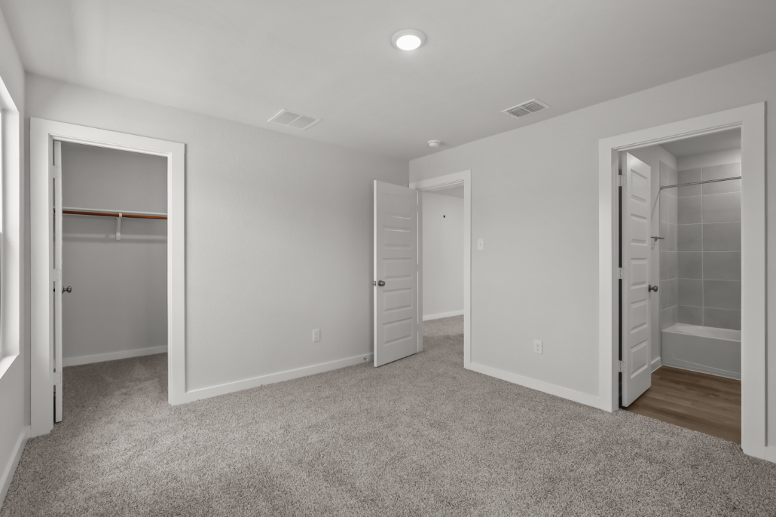 A room with white cabinets.