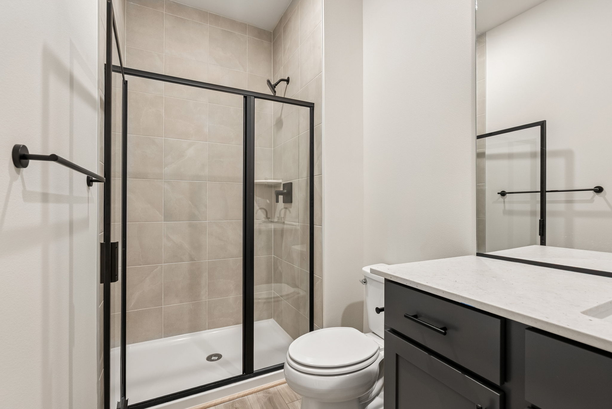 A bathroom with a glass shower.