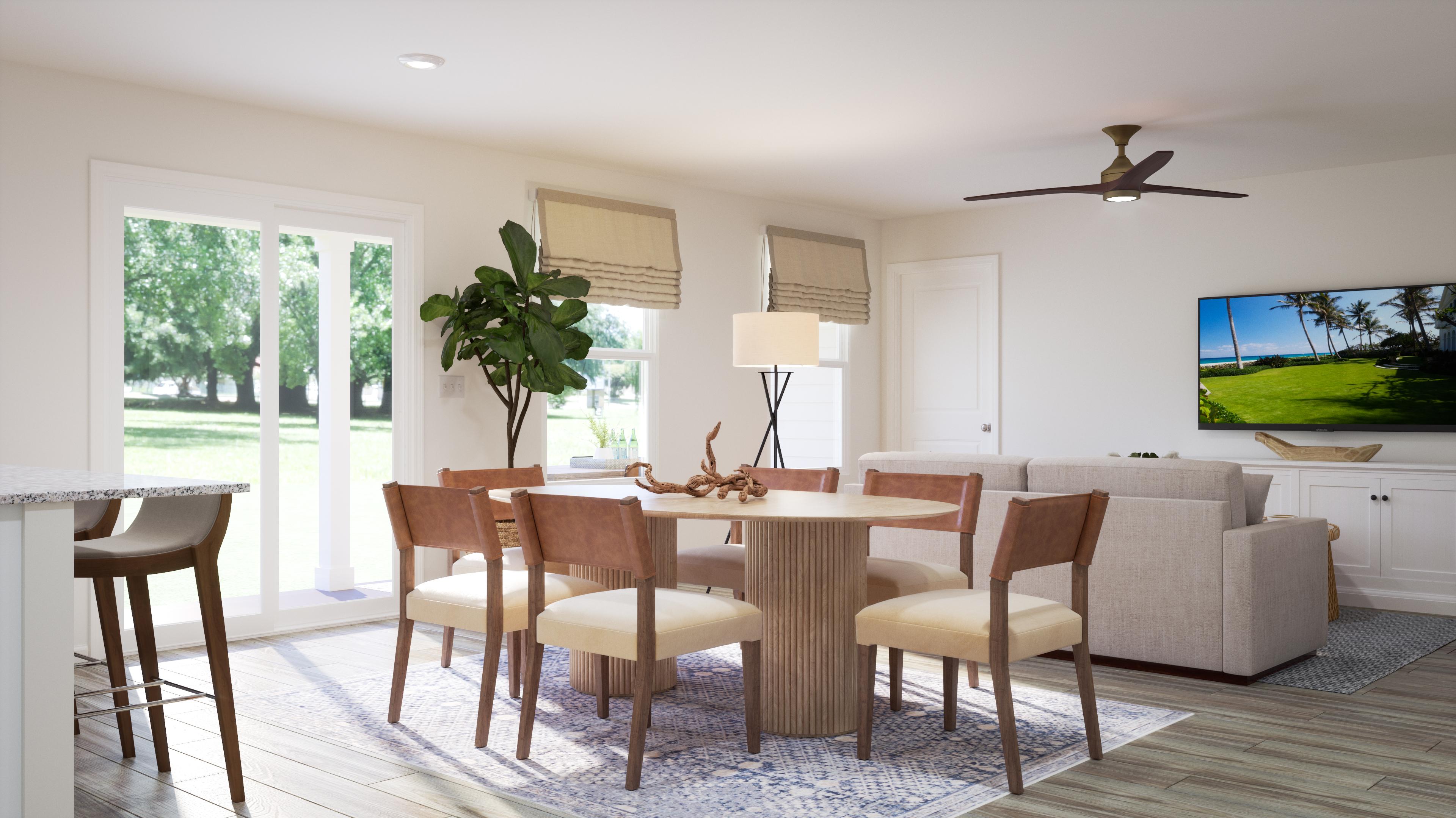 A dining room with a large television.