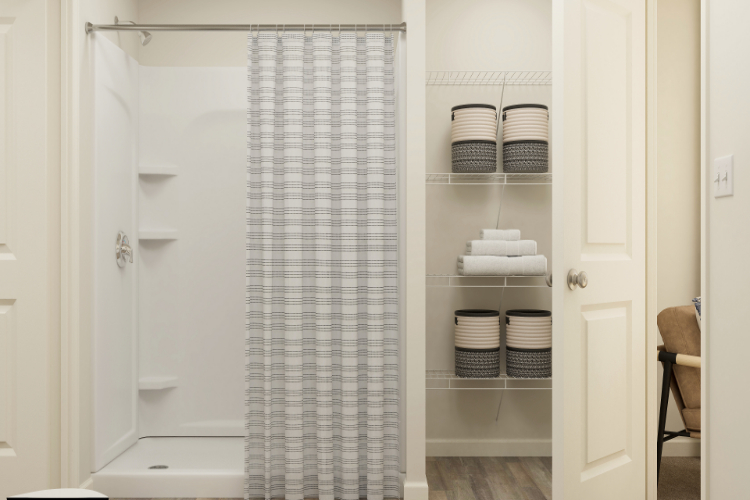 A shower with a glass door.