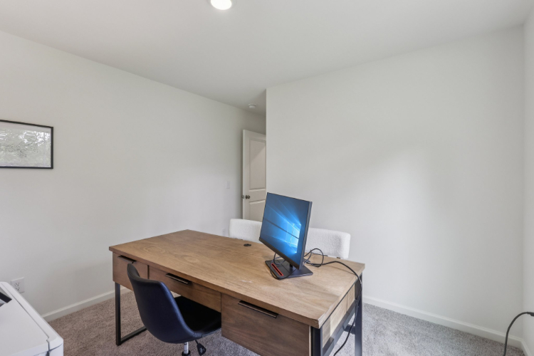 A desk with a computer on it.