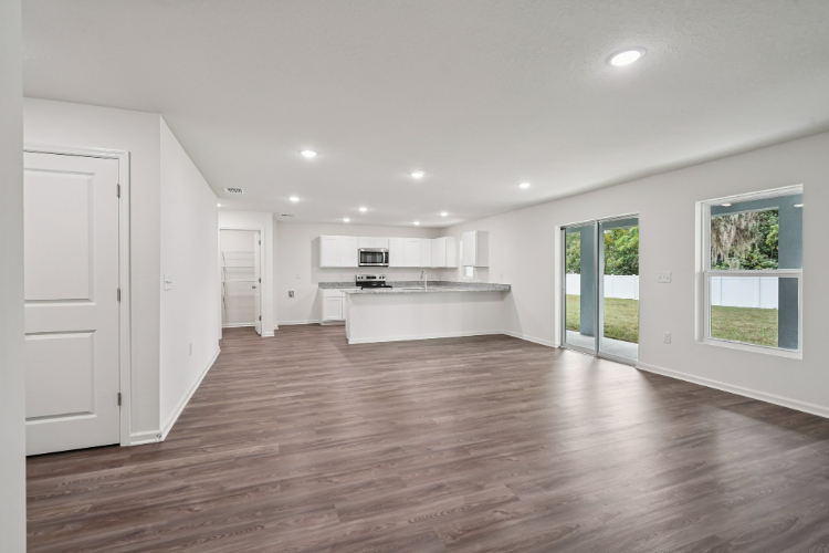 A large kitchen with white cabinets.