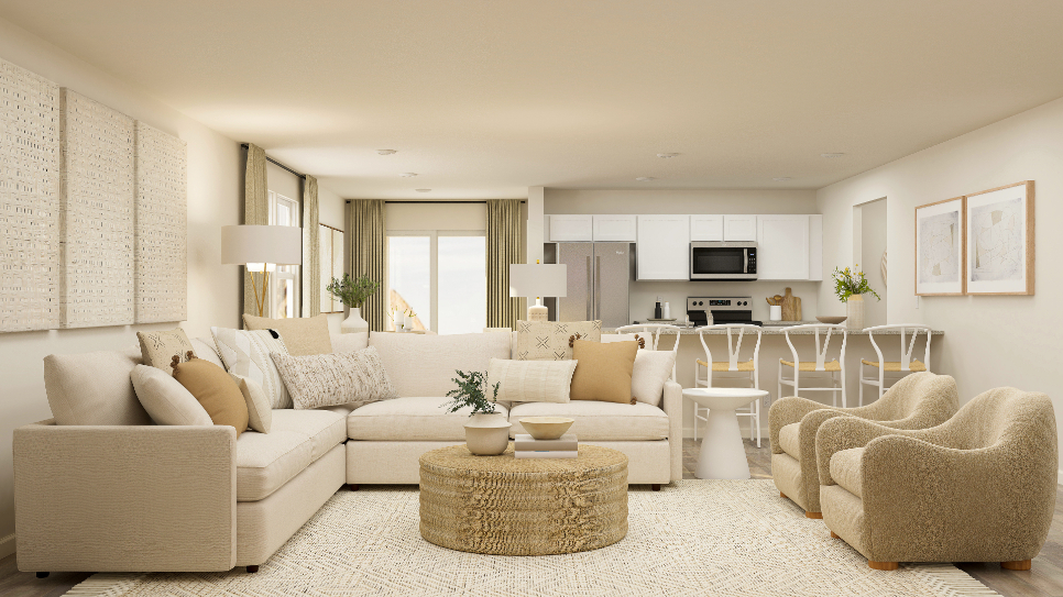 A living room with a large white couch and a table.