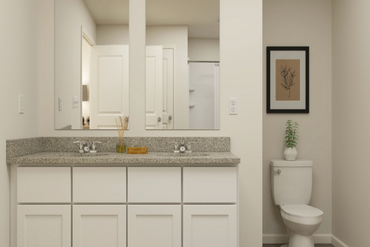 A bathroom with a marble countertop.