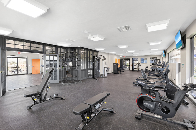 A gym with exercise equipment.