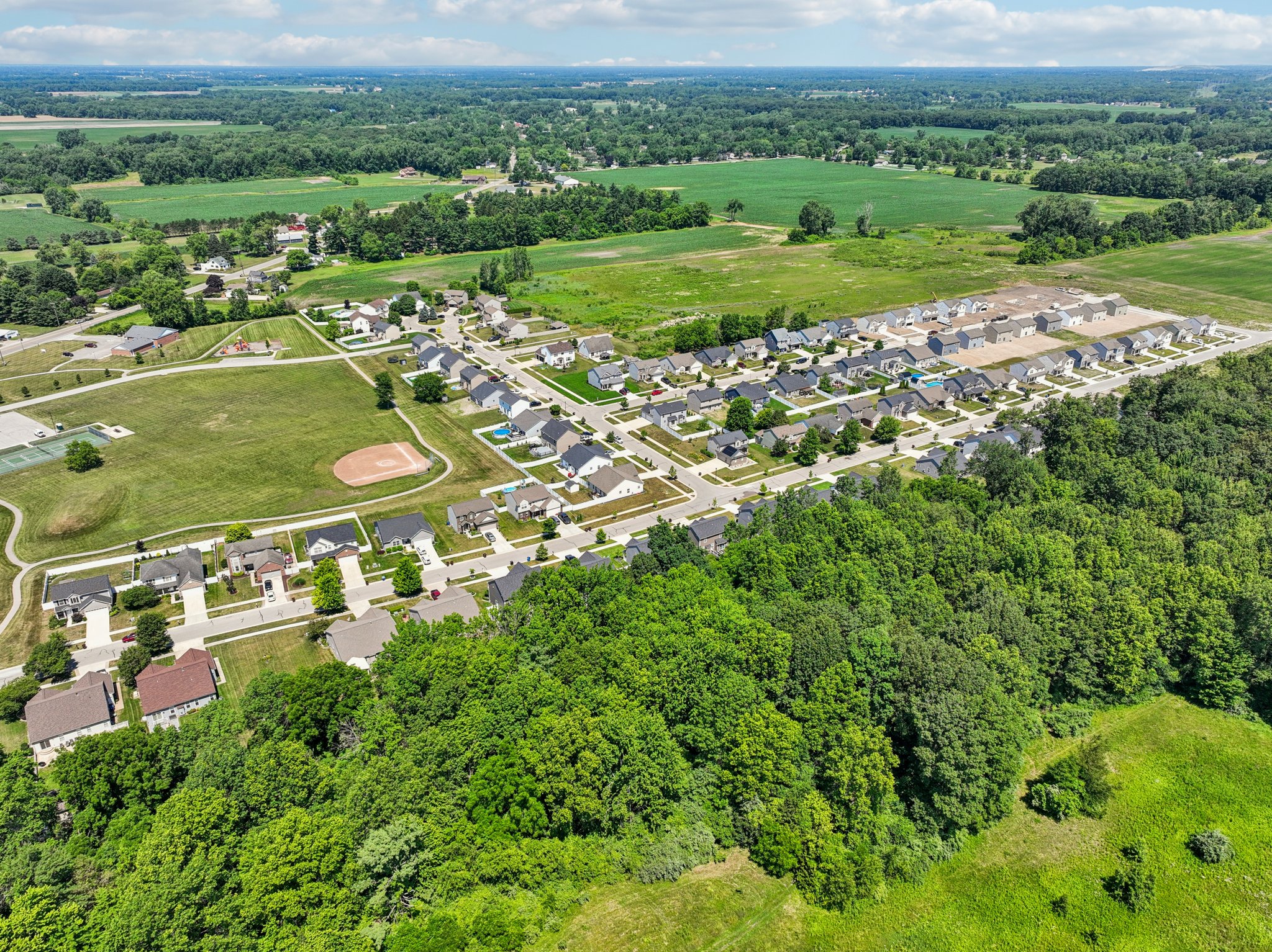 A landscape with trees and buildings.