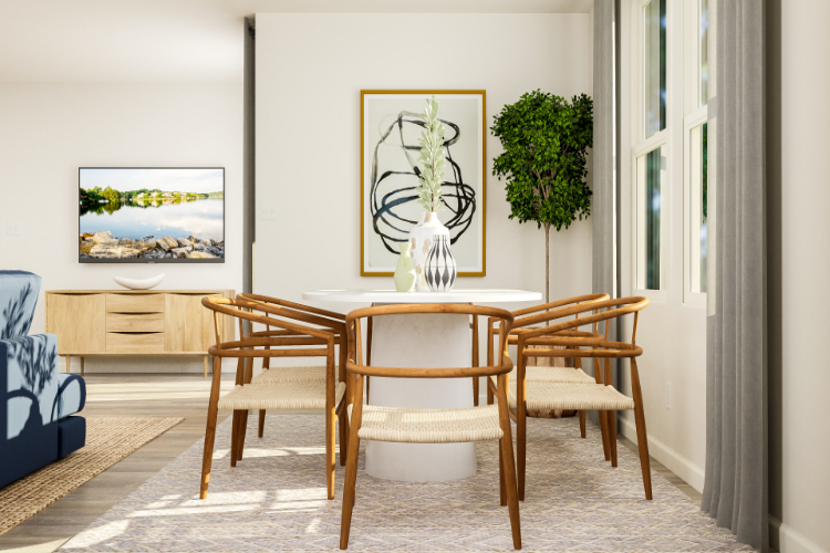 A dining room with a table and chairs.
